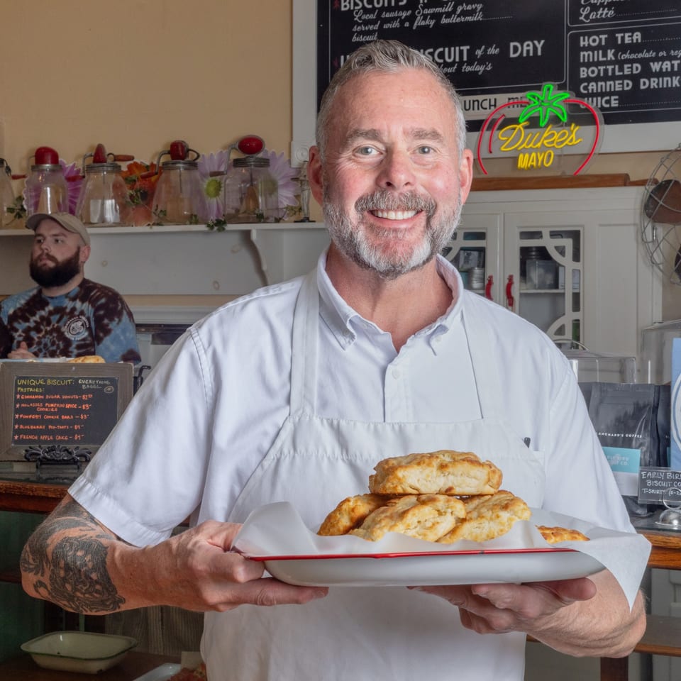 Owner holding fresh biscuits